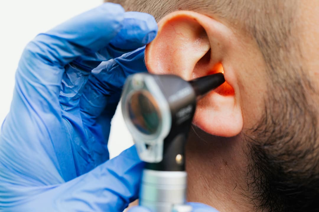 Audiologist conducting hearing test